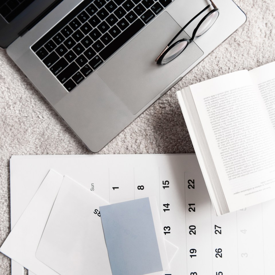 fear-of-being-forgotten-online flatlay of computer and calendar
